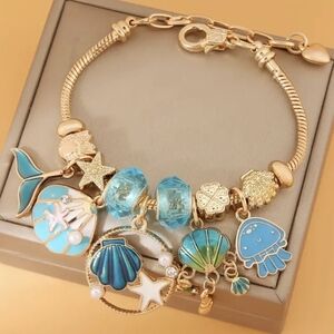 Gold Plated Seashell Beach Themed Charm Bracelet